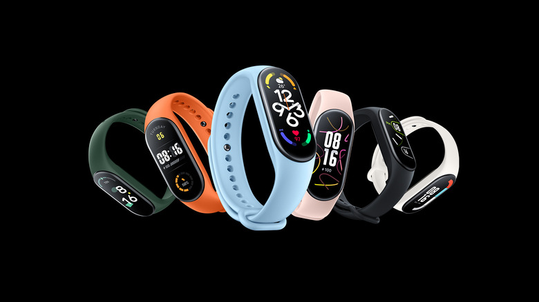 Xiaomi Mi Band 7 in green, orange, blue, pink, black, and white colors