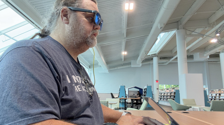 Man using the XReal xbx a01+ augmented reality glasses