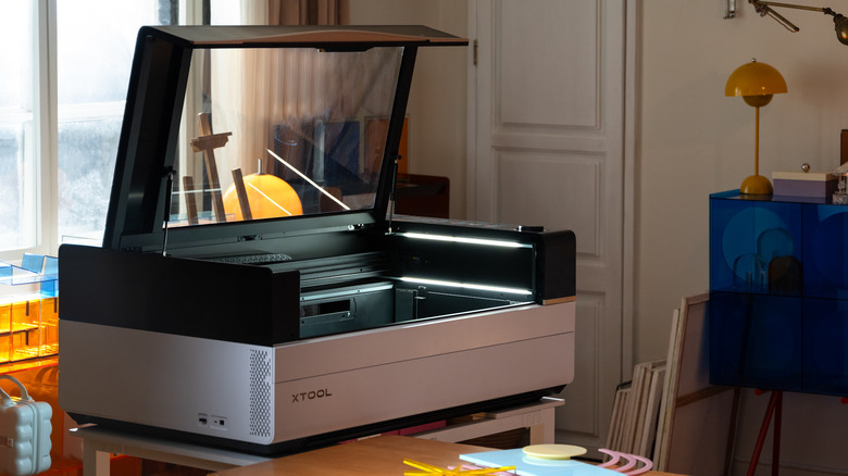xTool P3 CO₂ laser machine on desk in room