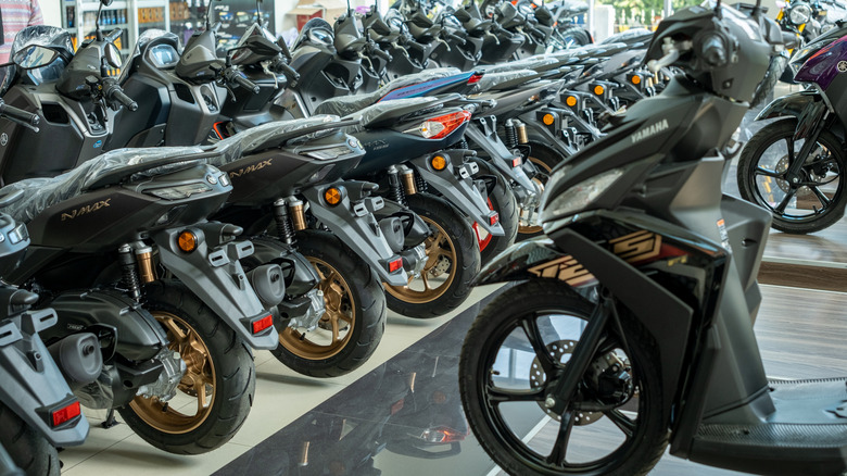A row of new Yamaha motorbikes in a showroom