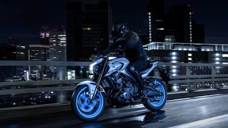 Yamaha MT-03 with a rider going over a bridge