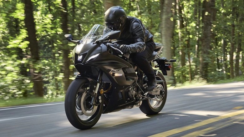Person riding a Yamaha R7 on a country road