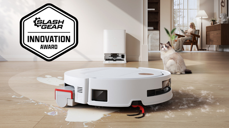 YEEDI M14 PLUS mopping up milk on floor with SlashGear Innovation Award badge
