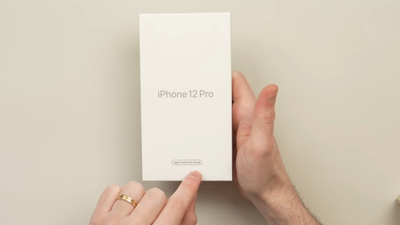 iPhone 12 Pro box in hand