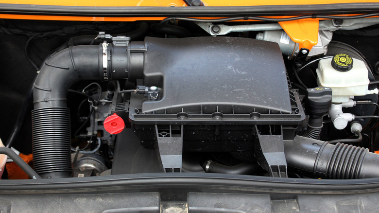 Diesel engine in Mercedes Sprinter van showing air filter