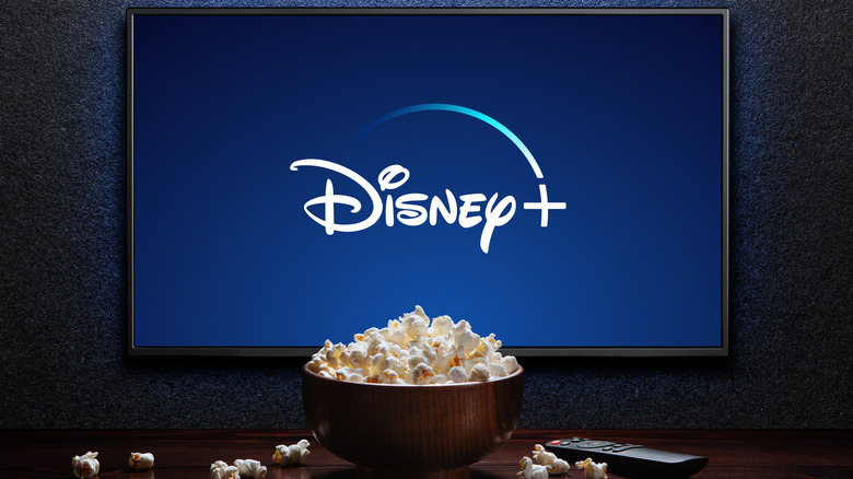 Bowl of popcorn placed in front of TV with Disney+ activated
