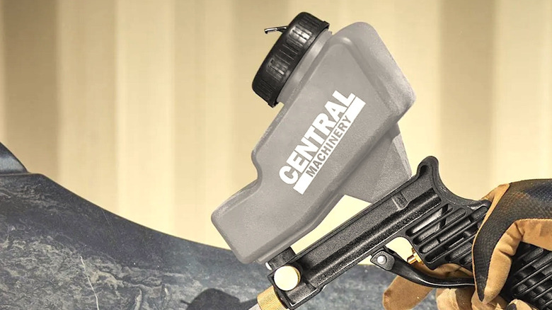 Person using portable Central Machinery blaster