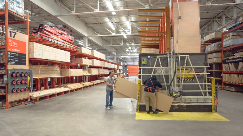Home Depot employee cutting wood