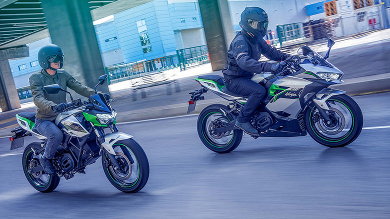 people riding kawasaki ninja e-1