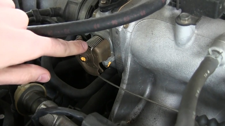 A throttle linkage with a mechanical cable attachment