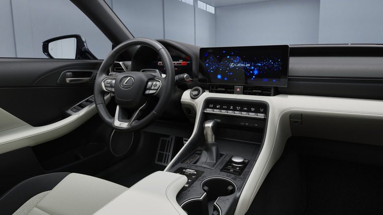 View of Lexus IS interior showing dash, console, steering wheel, driver's seat, and door