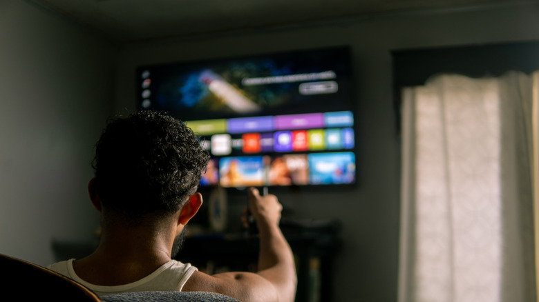 Man using a smart TV
