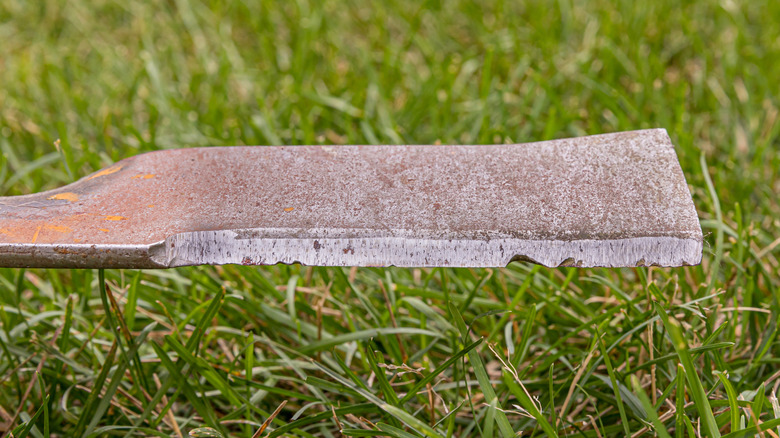A Dull And Damaged Mower Blade