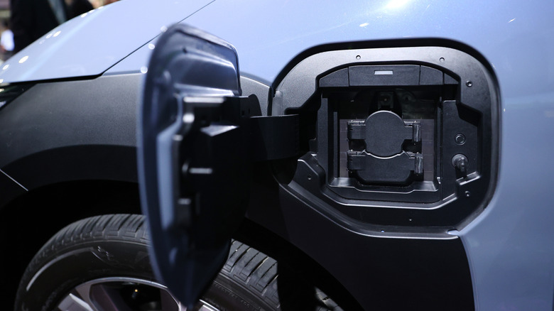 An open charging port door on the Subaru Solterra.
