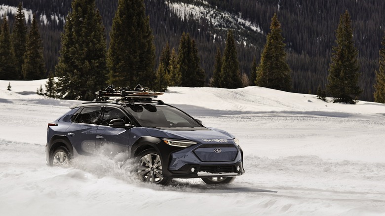 A Subaru Solterra driving on snow.