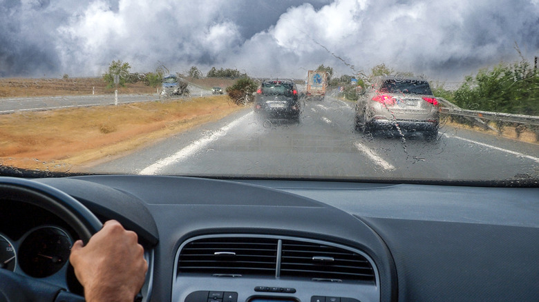 Person driving in rainy weather