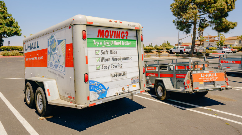 Man standing with U-Haul trailer