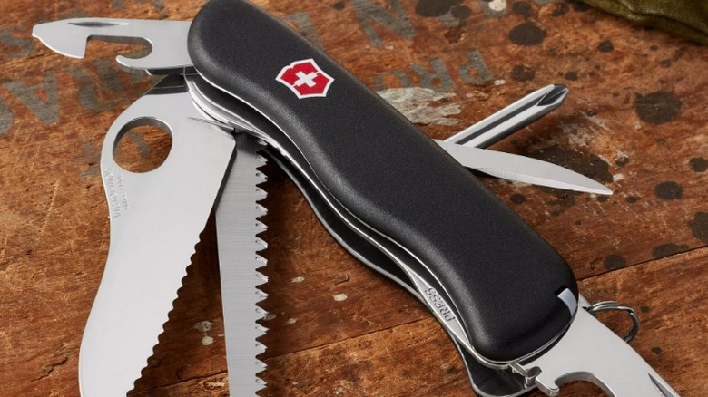 12-Function Ranger 78 M Swiss Army Knife on wooden work bench