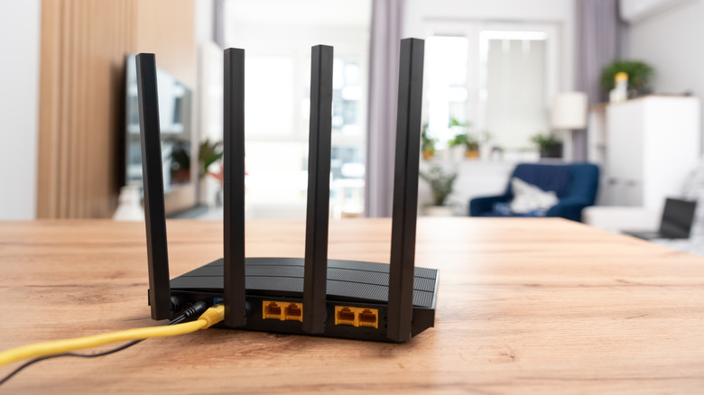 Black Wi-Fi router with four antenna