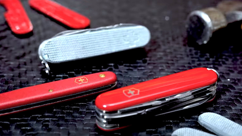Swiss Army Knives pictured with different scales
