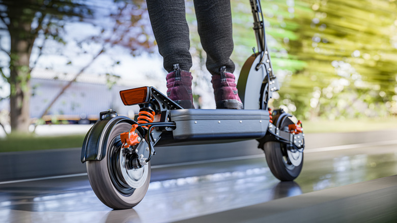 Person riding electric scooter