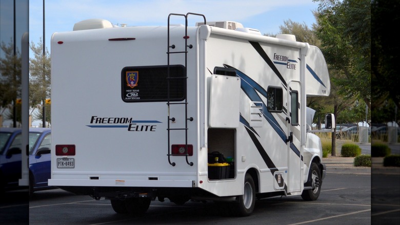 A Freedom Elite Class C motorhome city camping in a Walmart parking lot in Phoenix, AZ.