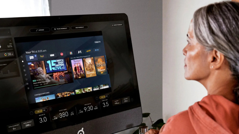 Woman looking at a Peloton screen