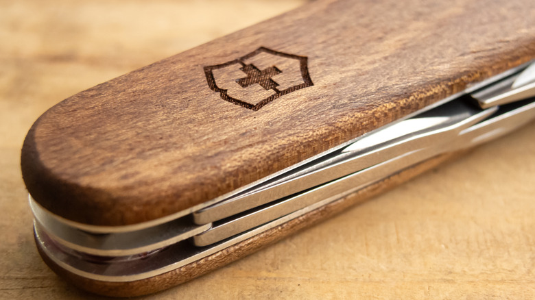 Victorinx Swiss Army Knife logo branded on wooden frame
