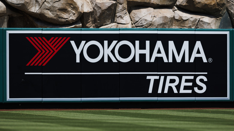 The Yokohama Tire brand and logo displayed near a rocky feature wall