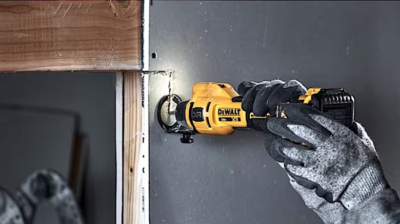 Person using DeWalt cutting tool