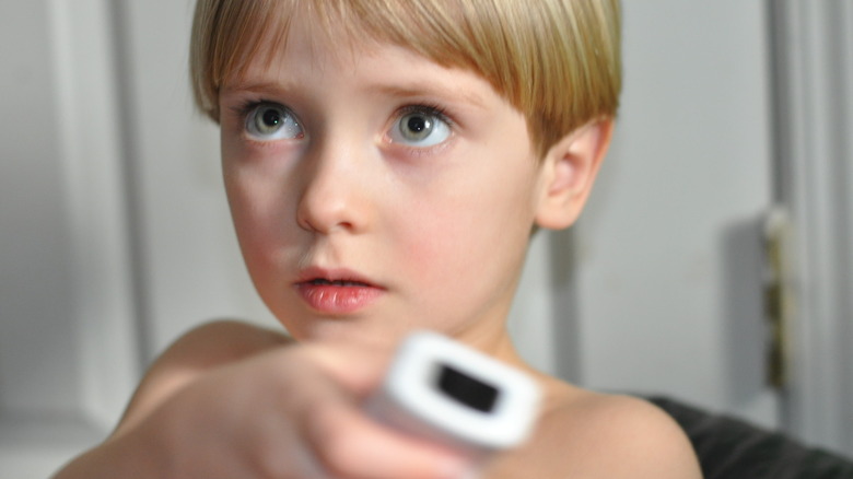 Child holding Nintendo Wii controller