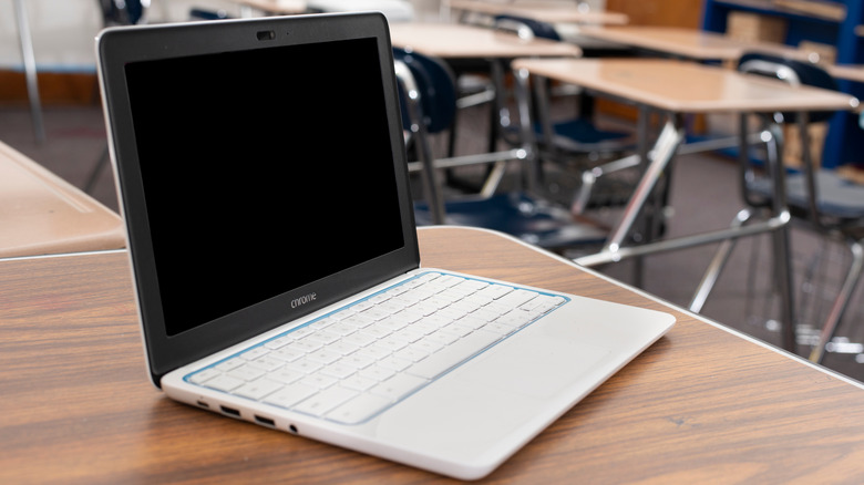 White HP Chromebook on a wooden table