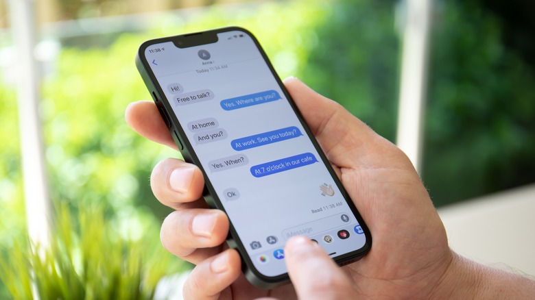 iPhone user using Messages app