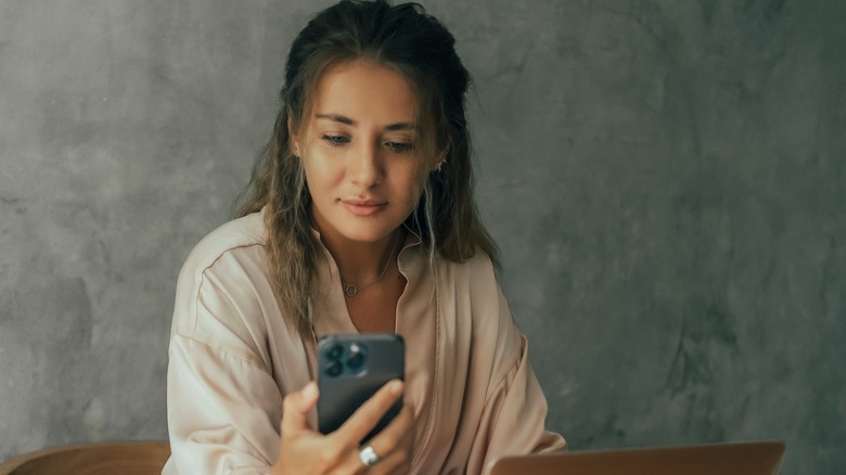 woman using an iphone