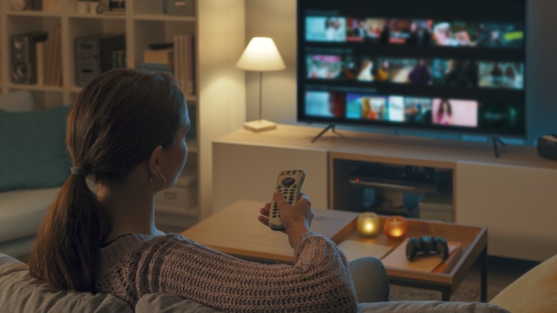 Woman using smart TV