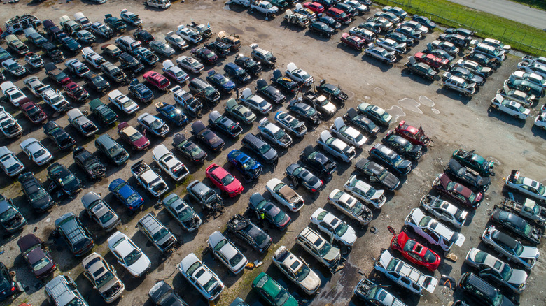 Aerial view of cars parked in junkyard.