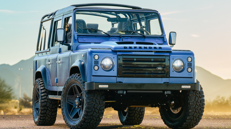 Land Rover Defender 110 parked showing the grille