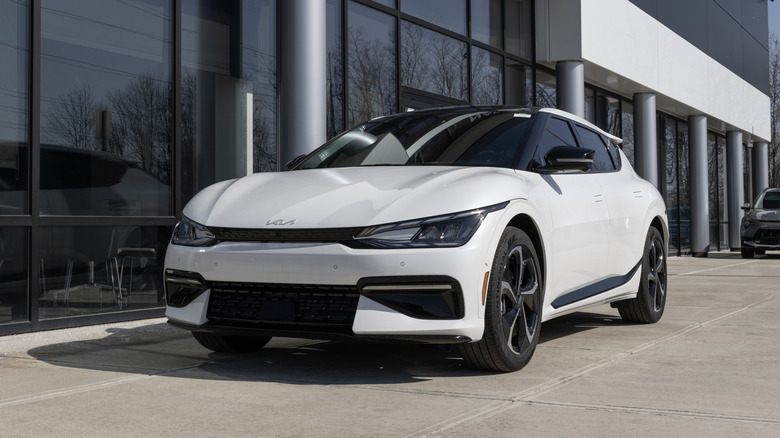 White Kia EV6 parked outside a building