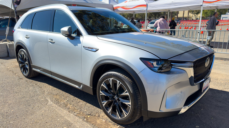 White Mazda CX-90 Hybrid at a car show
