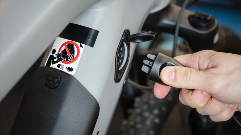 plugging charger into ebike