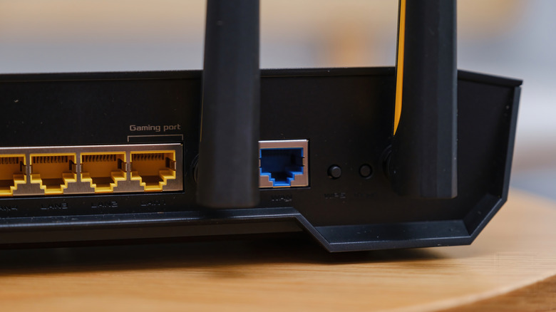 gaming router placed on a table showing the LAN and WAN ports, including a dedicated gaming port