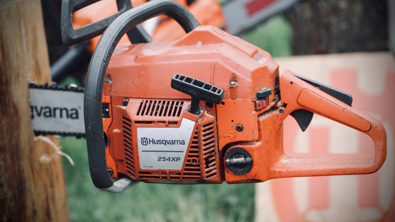 The handle of a Husqvarna chainsaw.