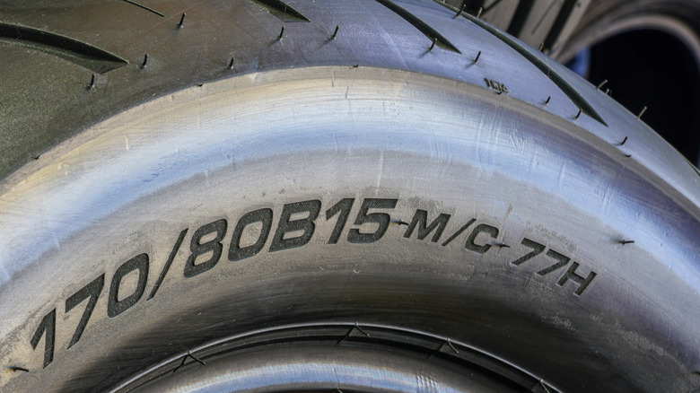 A close-up of the dimensions written on the side of a motorcycle tire