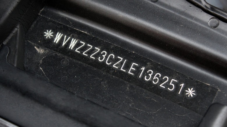 a car's VIN located under the hood
