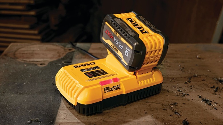 DeWalt Flexvolt battery connected to charger in workshop