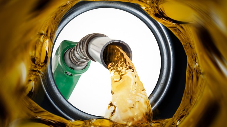 Refilling car gas tank with a view from inside the tank