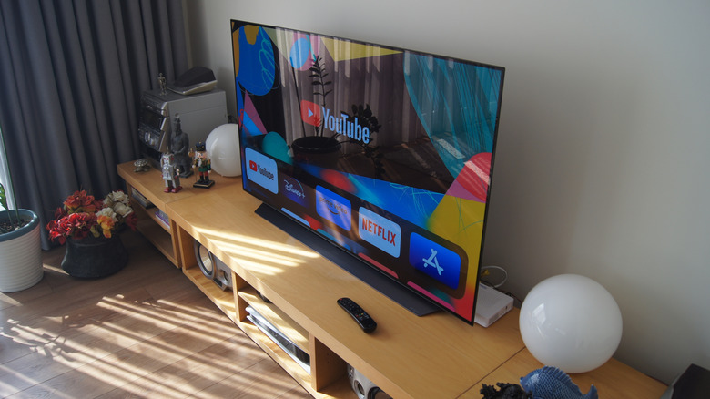 An LG OLED TV on a desk