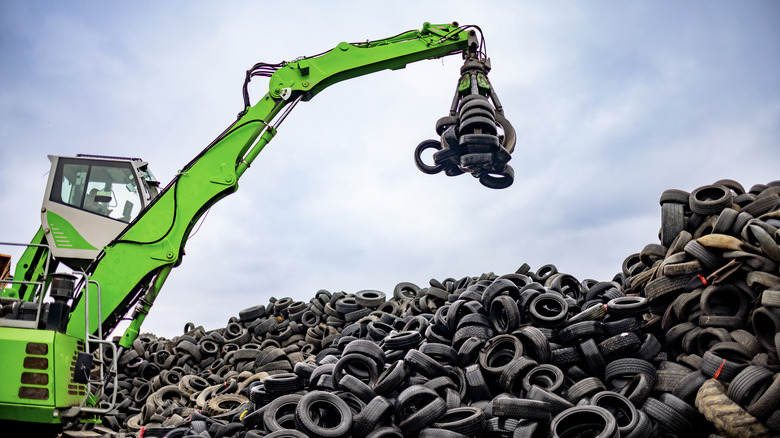 A large stack of used vehicle tires