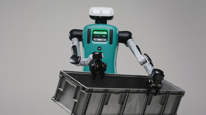 Agility Robotics' Digit humanoid robot carrying a large plastic bin