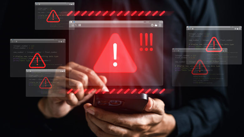 Cyber threat warning with red alert icons showing online danger.